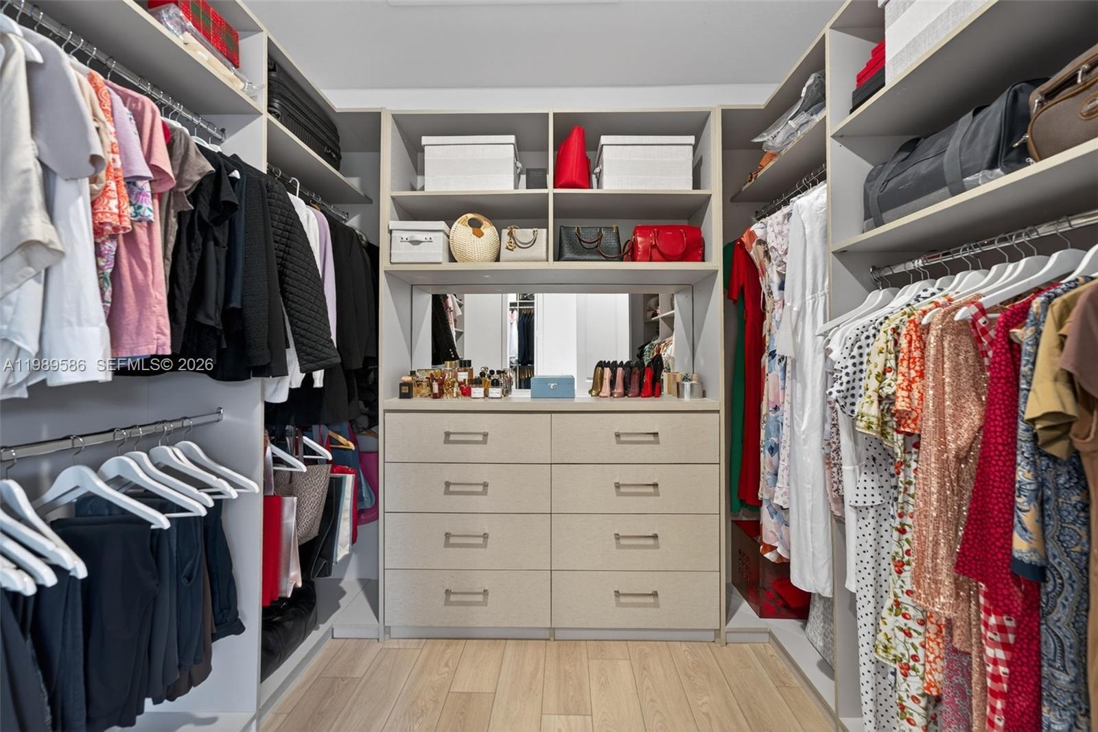 8267 Southwest 120th Terrace Miami, FL 33156 - Photo 22 of 61 a view of walk in closet with clothes and shoes