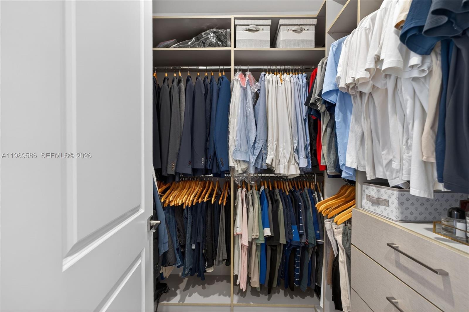 8267 Southwest 120th Terrace Miami, FL 33156 - Photo 23 of 61 a view of walk in closet with clothes