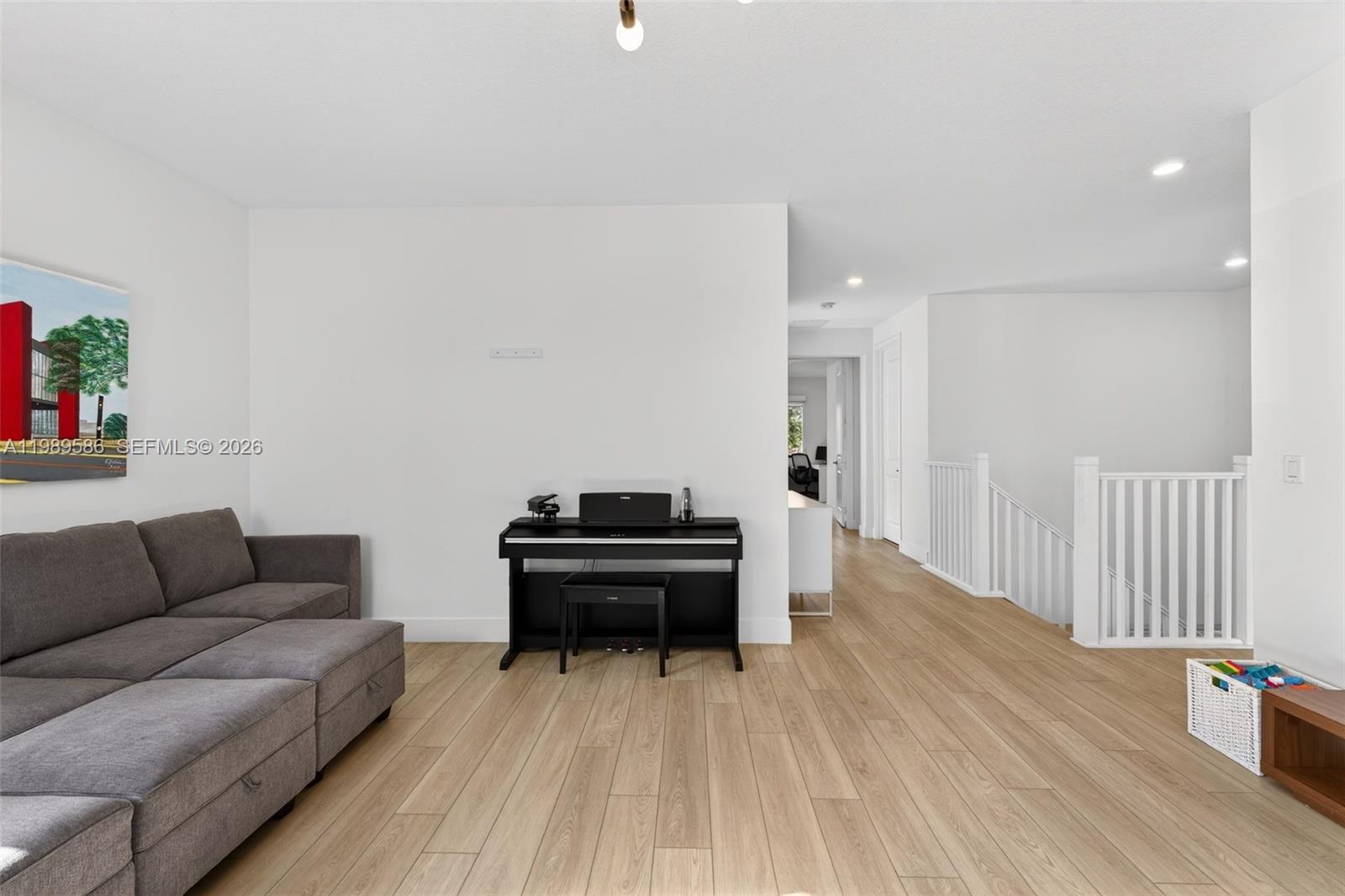 8267 Southwest 120th Terrace Miami, FL 33156 - Photo 30 of 61 a living room with furniture and a wooden floor