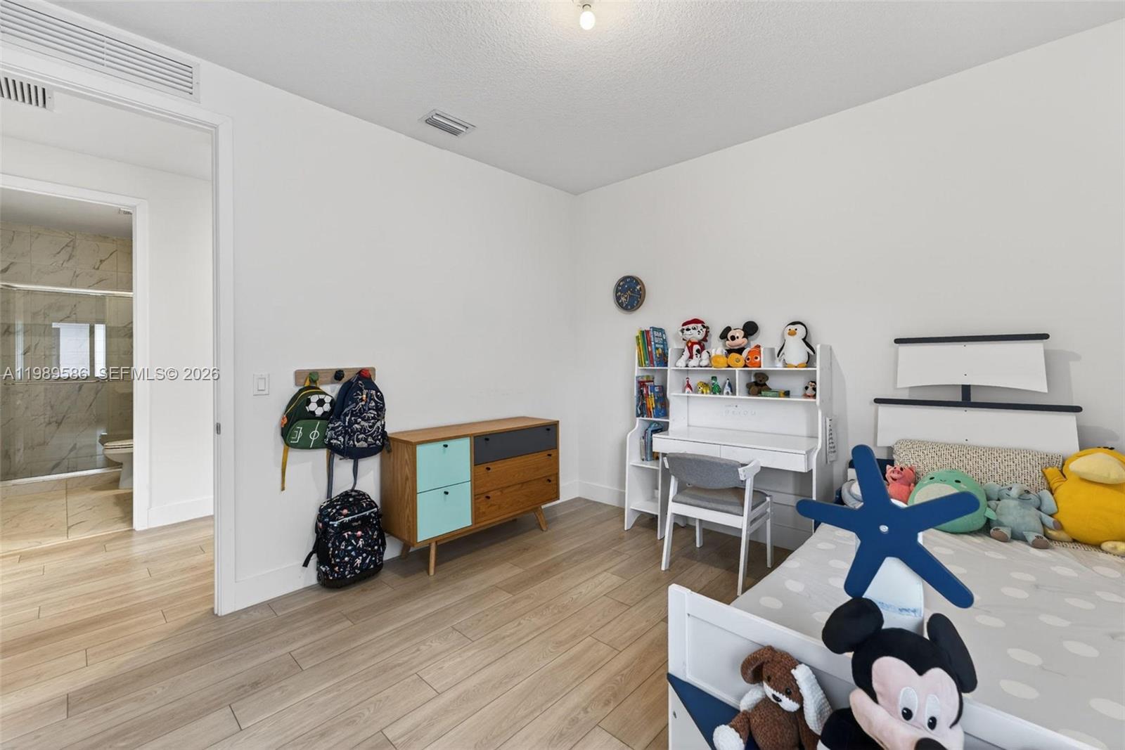 8267 Southwest 120th Terrace Miami, FL 33156 - Photo 34 of 61 a view of a workspace with furniture and wooden floor