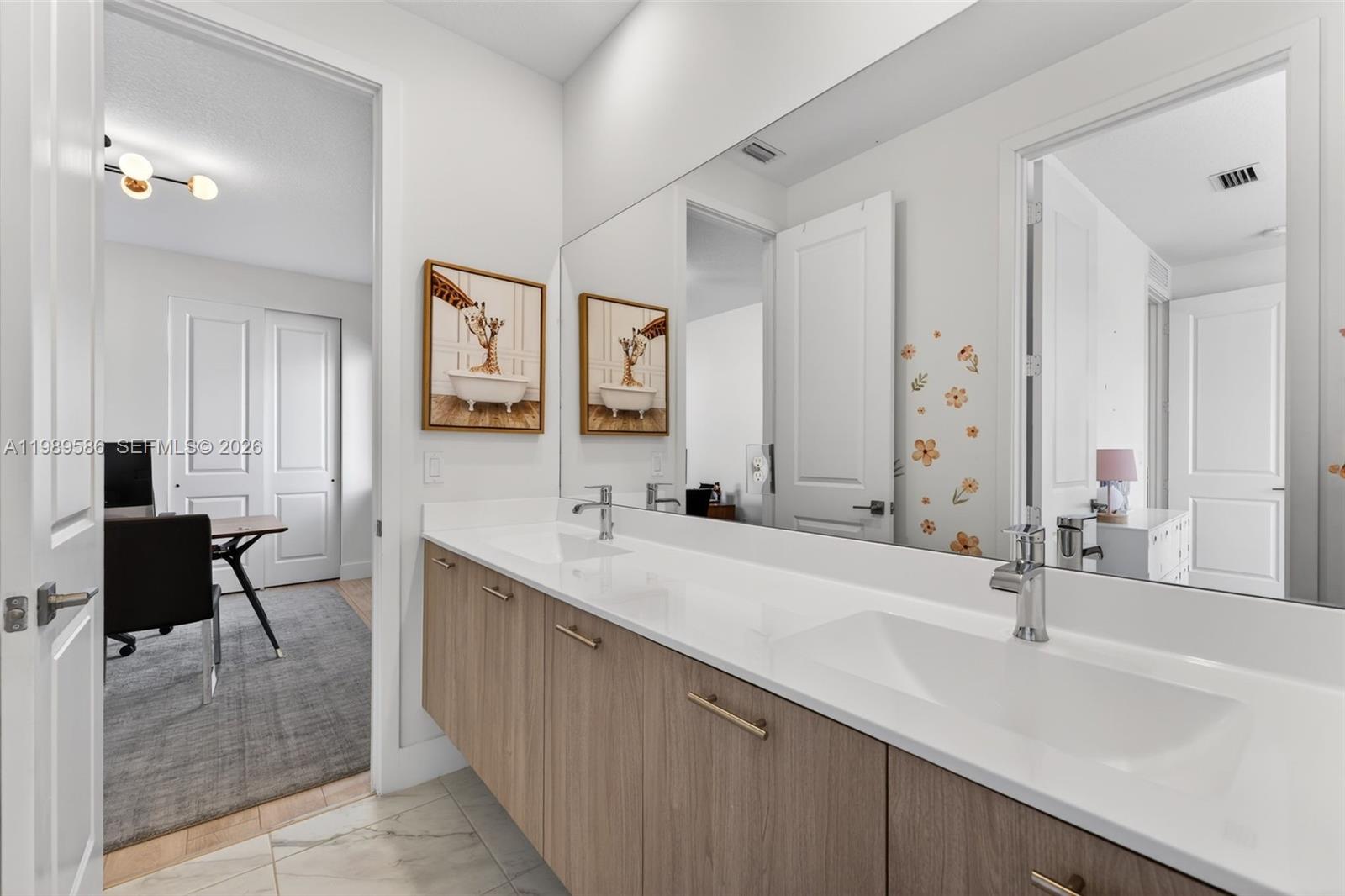 8267 Southwest 120th Terrace Miami, FL 33156 - Photo 35 of 61 a bathroom with a sink and a mirror
