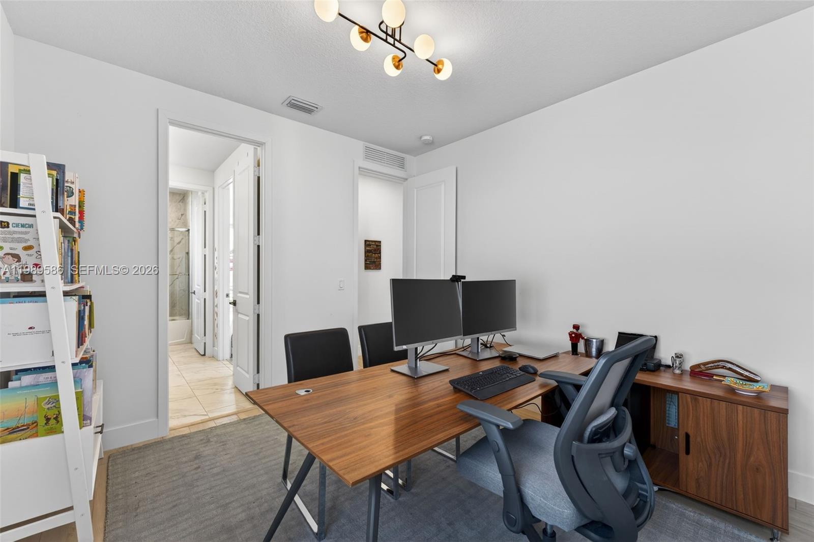 8267 Southwest 120th Terrace Miami, FL 33156 - Photo 37 of 61 a workspace with furniture and wooden floor