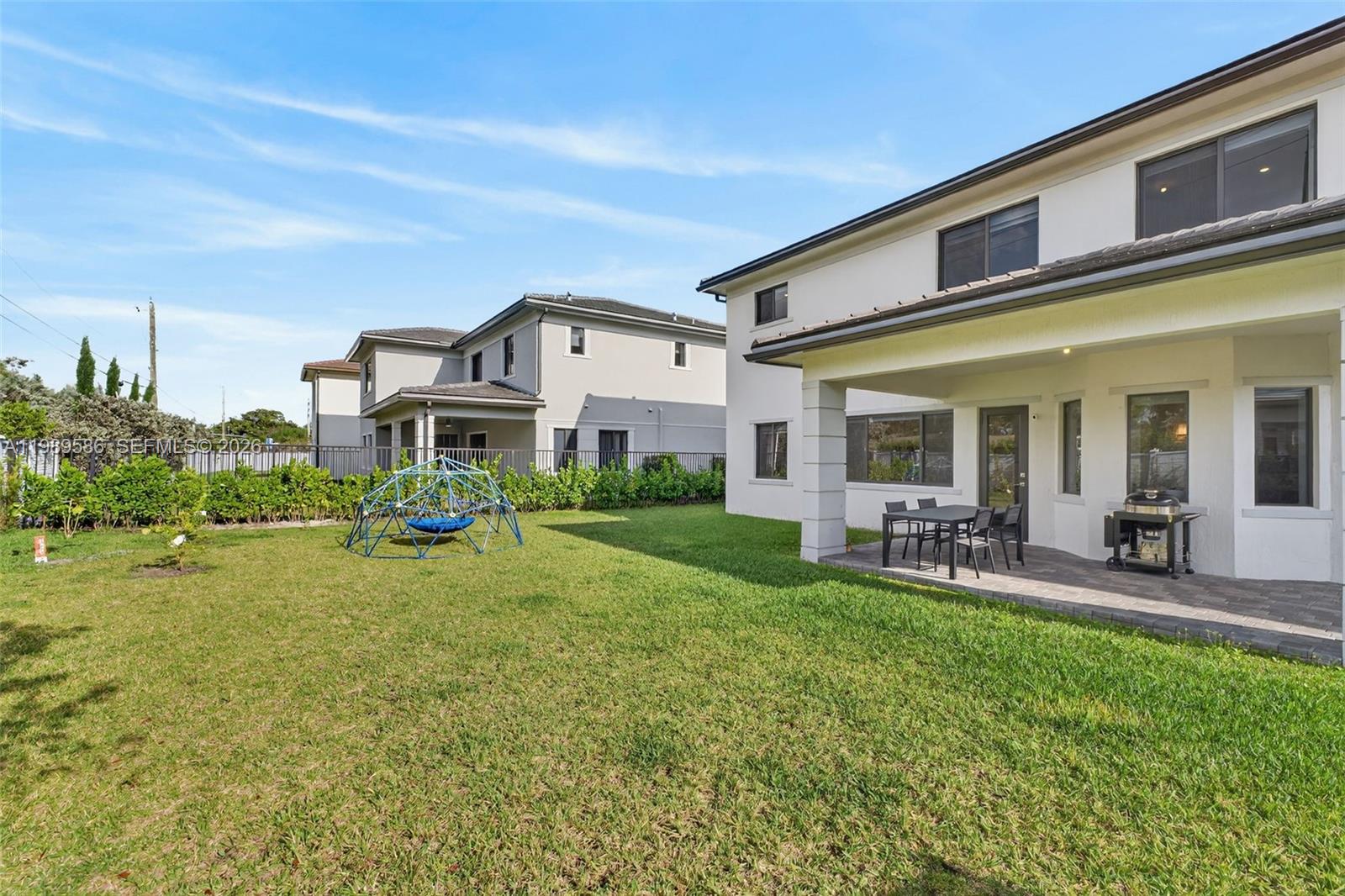 8267 Southwest 120th Terrace Miami, FL 33156 - Photo 47 of 61 a view of a house with backyard porch and sitting area