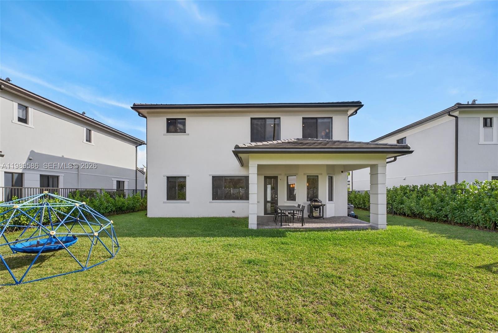 8267 Southwest 120th Terrace Miami, FL 33156 - Photo 48 of 61 a front view of a house with garden