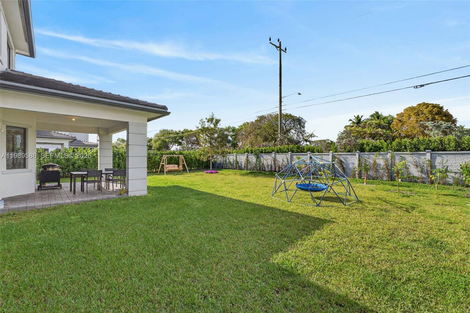 8267 Southwest 120th Terrace Miami, FL 33156 - Photo 50 of 61 a view of a house with backyard and a slide