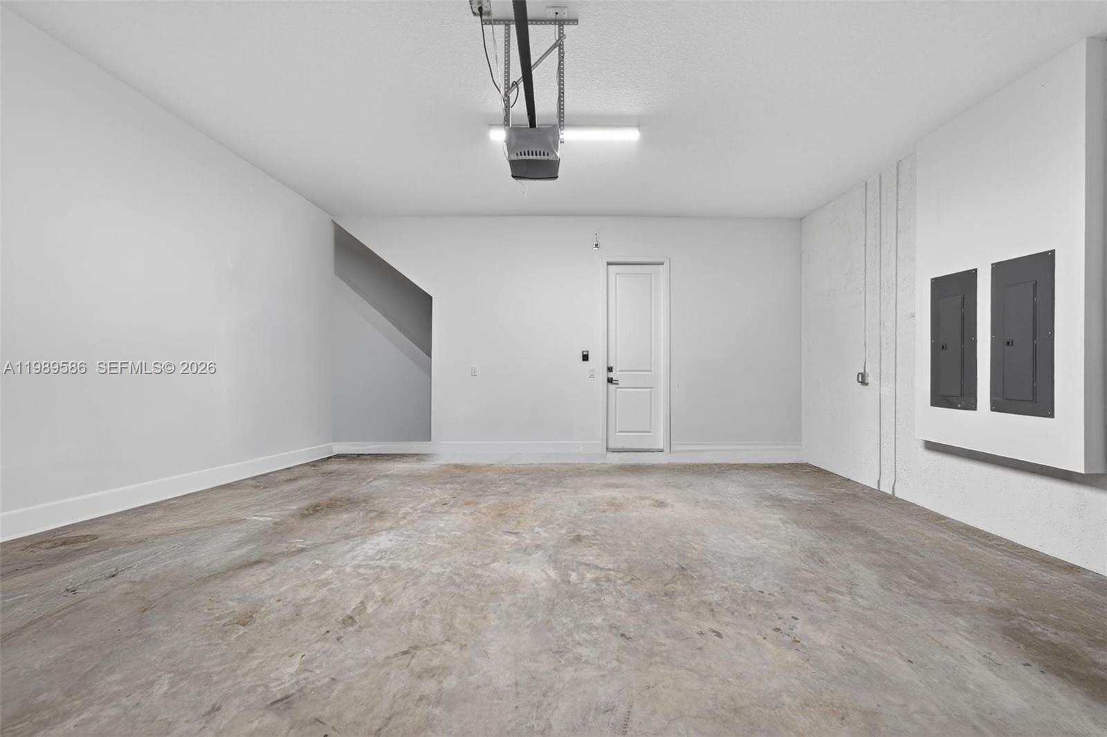 8267 Southwest 120th Terrace Miami, FL 33156 - Photo 52 of 61 a view of an empty room with chandelier