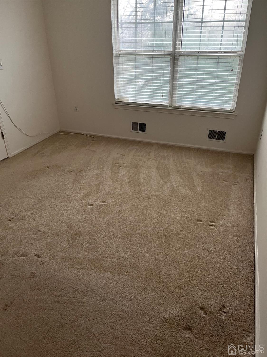 1711 Ridgeview Court Sayreville, NJ 08859 - Photo 18 of 18 a view of an empty room with a window