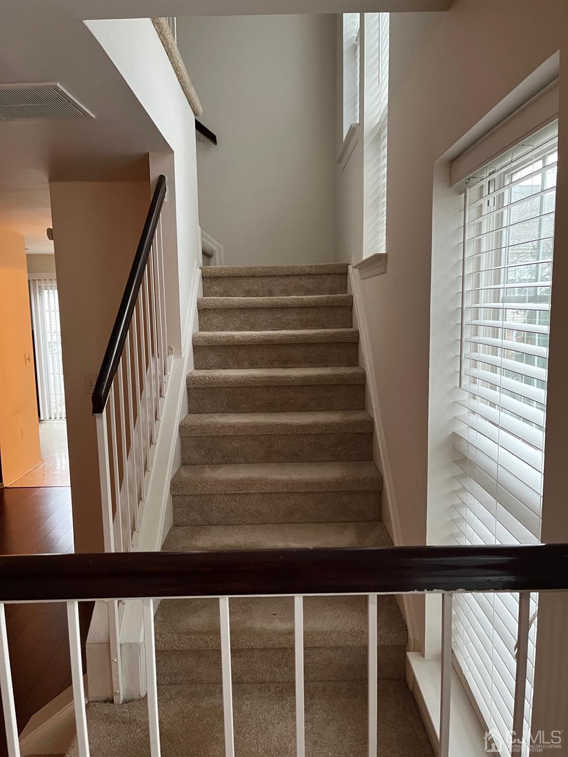1711 Ridgeview Court Sayreville, NJ 08859 - Photo 8 of 18 a view of staircase with wooden floor and white walls