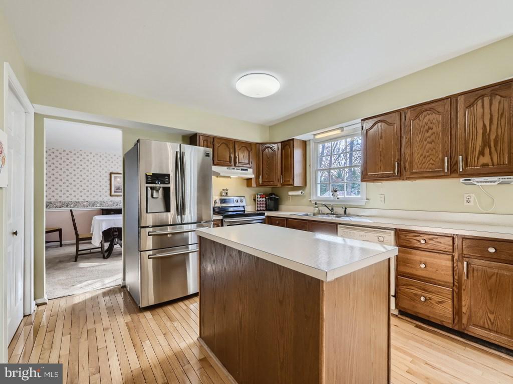 7904 Poplar Grove Road Severn, MD 21144 - Photo 11 of 33 Kitchen with Stainless Refrigerator and Stove