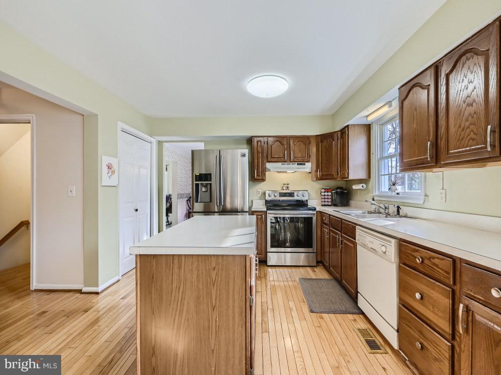 7904 Poplar Grove Road Severn, MD 21144 - Photo 12 of 33 Kitchen with Hardwood Floors