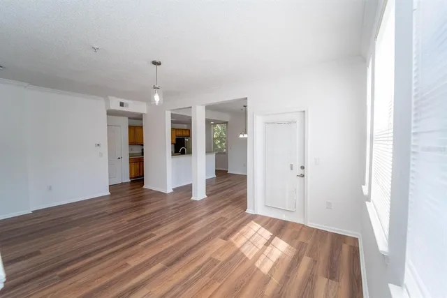 a room with window and wooden floor