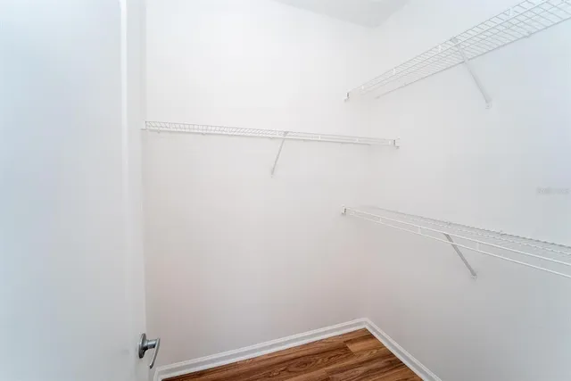 a view of balcony with wooden floor