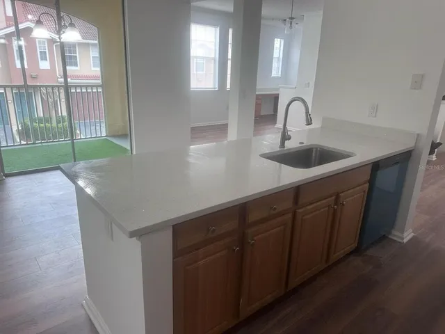 a kitchen with a sink and cabinets