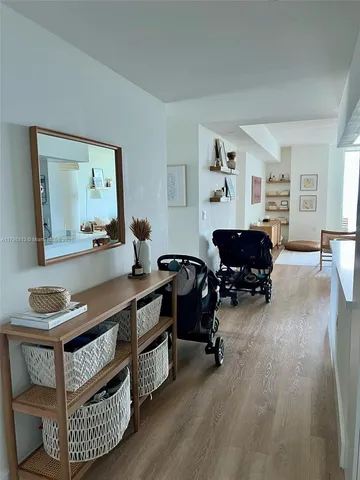 a kitchen with kitchen island a counter top space a sink stainless steel appliances and cabinets