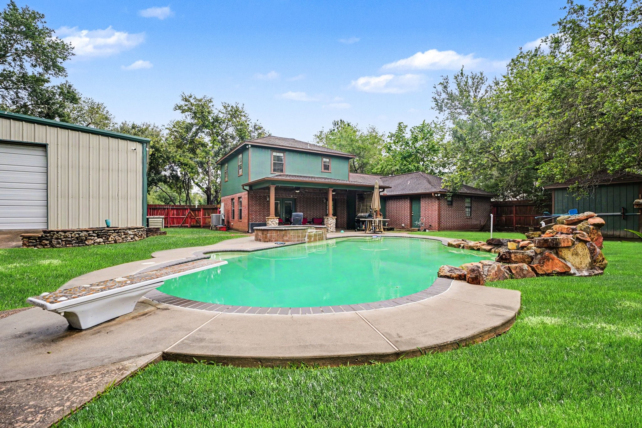 5104 Avenue R Santa Fe, TX 77510 - Photo 17 of 35 The setting is private and inviting, ideal for outdoor activities and relaxation.