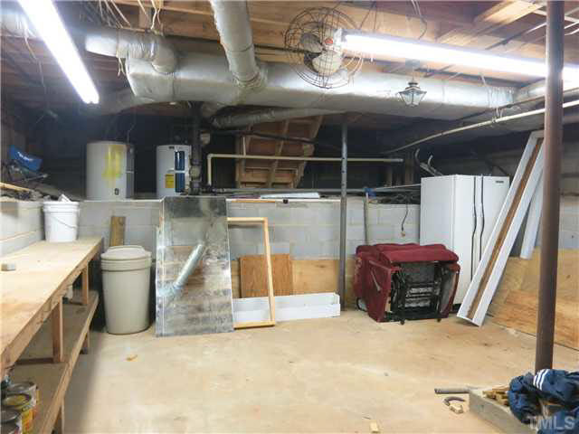 4700 St Thomas Place Raleigh, NC 27612 - Photo 17 of 25 View of the big basement Workshop w/workbenches. Workshop