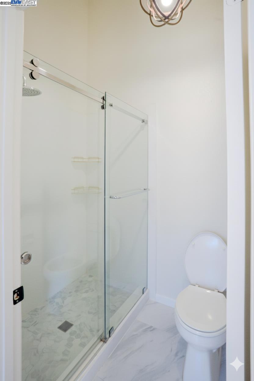 219 Commons Lane Foster City, CA 94404 - Photo 27 of 33 a bathroom with a toilet and a shower