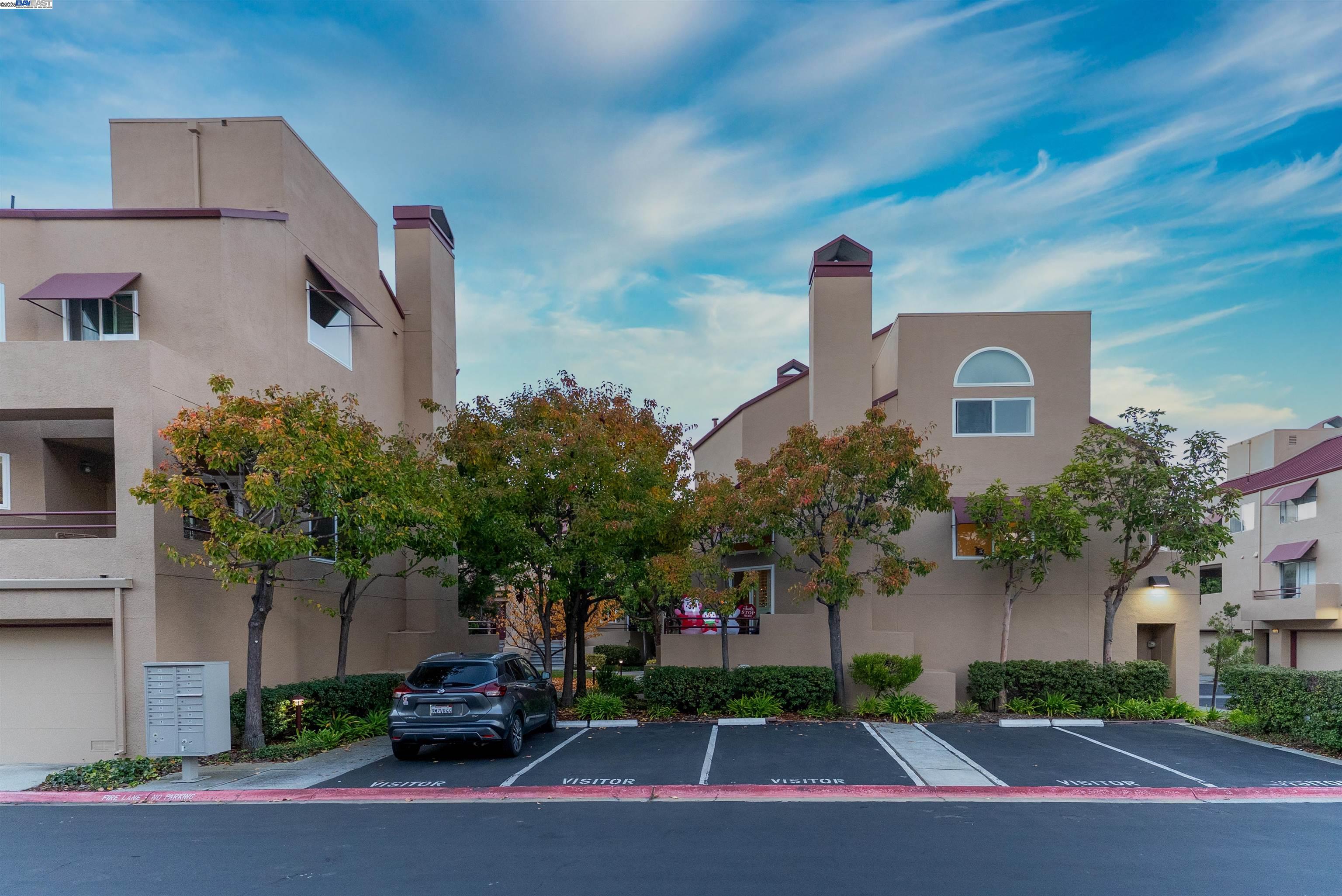 219 Commons Lane Foster City, CA 94404 - Photo 33 of 33 a front view of a house with garden