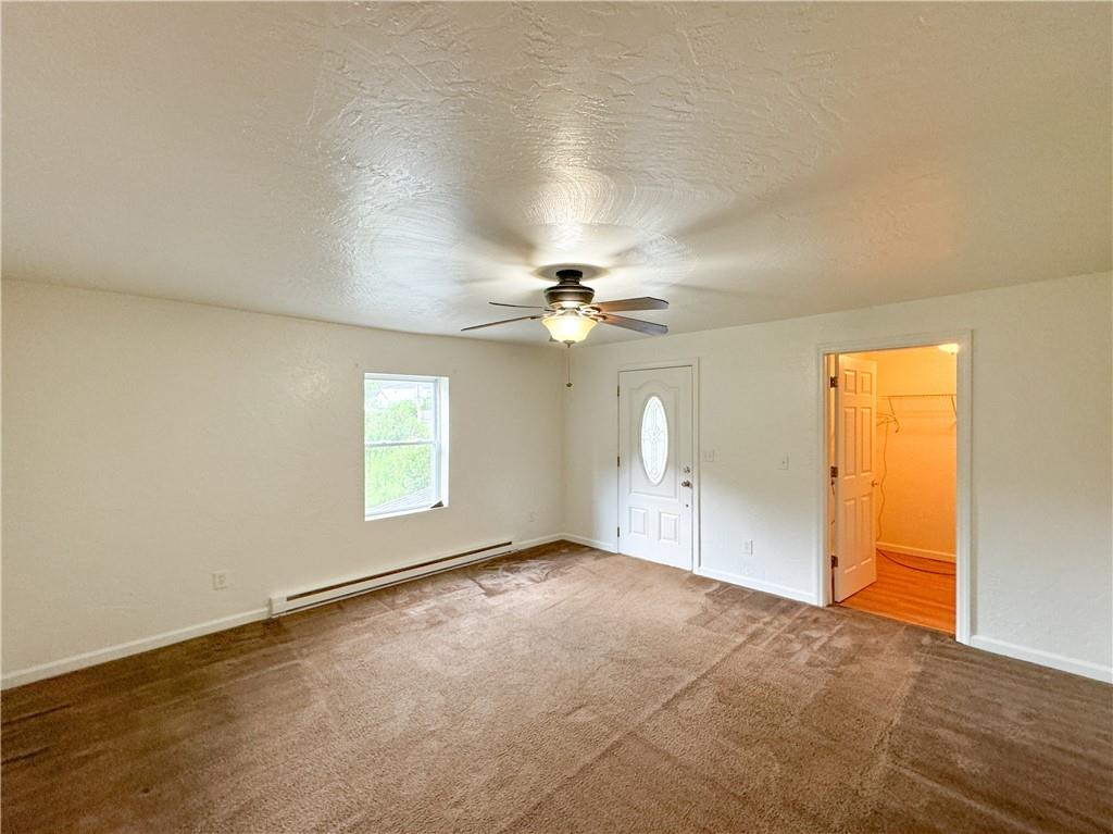 160 Francis Mine State Road Burgettstown, PA 15021 - Photo 3 of 12 an empty room with windows and fan