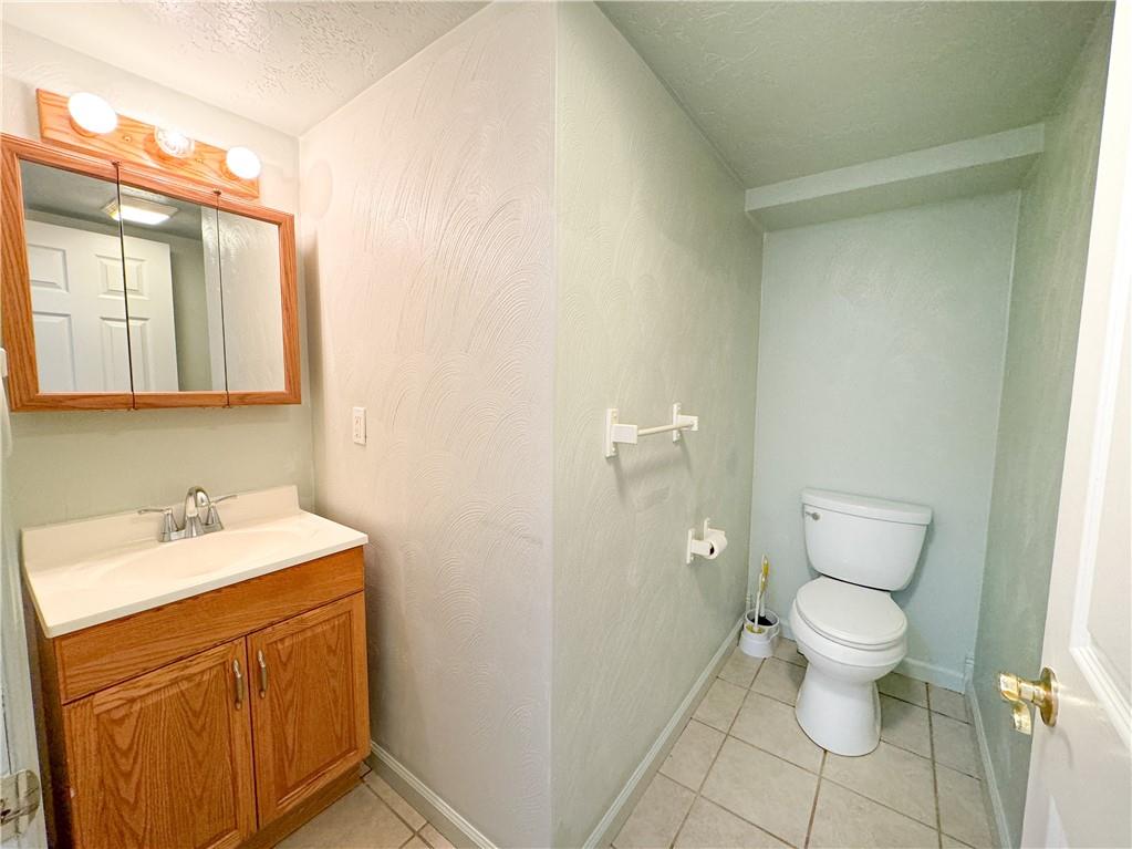 160 Francis Mine State Road Burgettstown, PA 15021 - Photo 8 of 12 a bathroom with a sink a toilet and mirror