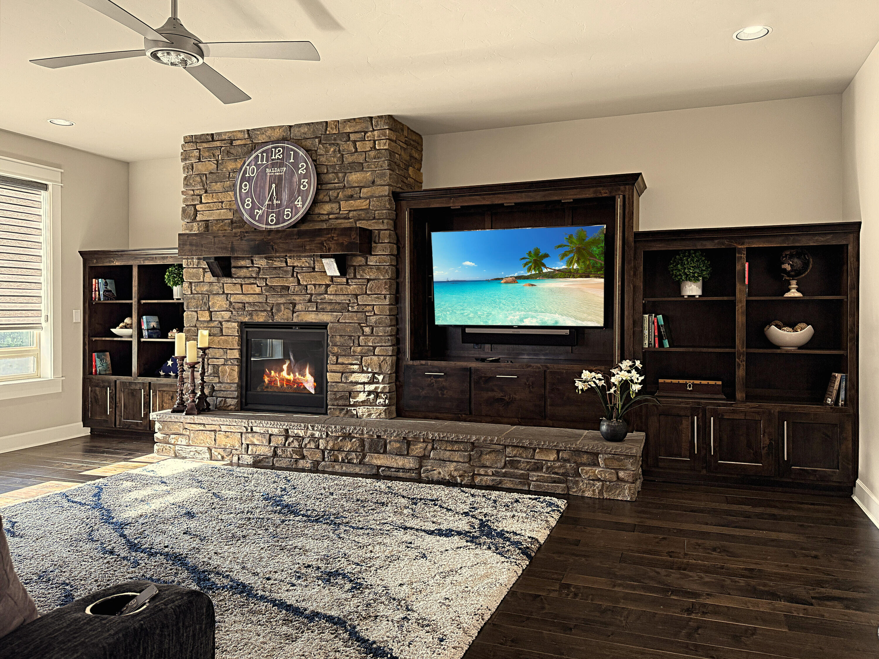 61072 Manhae Loop Bend, OR 97702 - Photo 12 of 63 a living room with furniture a flat screen tv and a fireplace