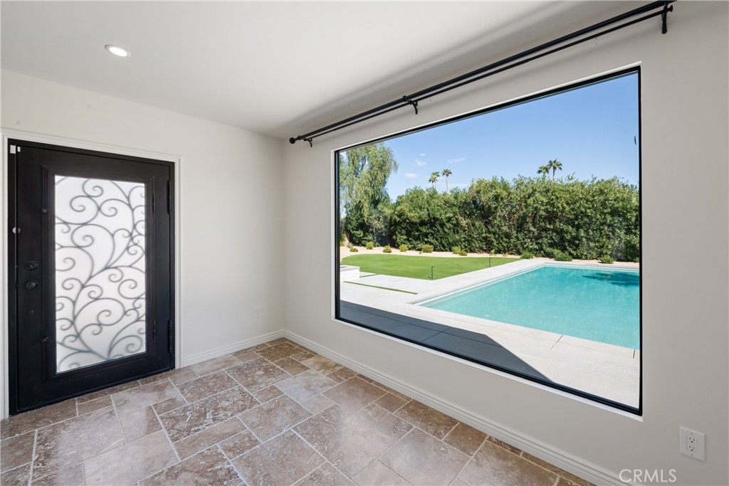 72408 Desert Drive Rancho Mirage, CA 92270 - Photo 11 of 42 Picture window out into the backyard from the livingroom