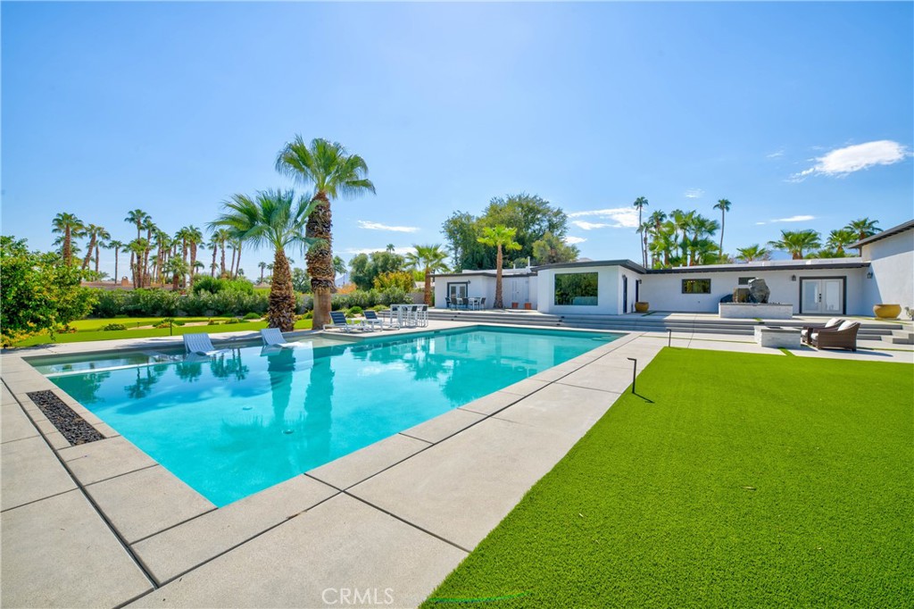 72408 Desert Drive Rancho Mirage, CA 92270 - Photo 28 of 42 Fire feature at the far end of the pool