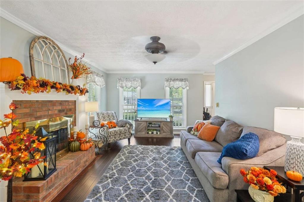 275 Fairview Chase Road Covington, GA 30016 - Photo 5 of 35 a bedroom with furniture and a fireplace