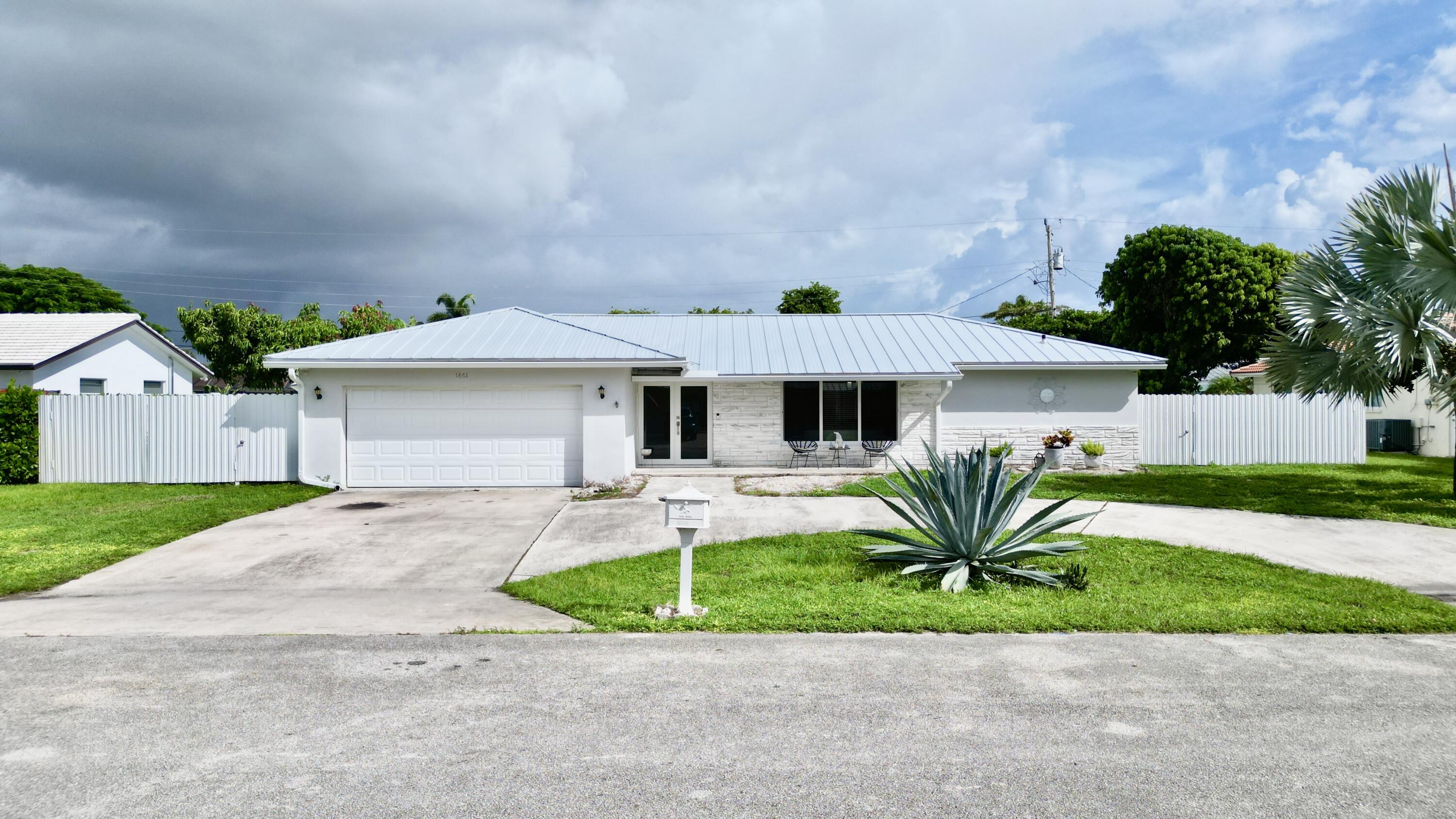 1861 Caribbean Road West Lake Clarke Shores, FL 33406 - Photo 4 of 73 5