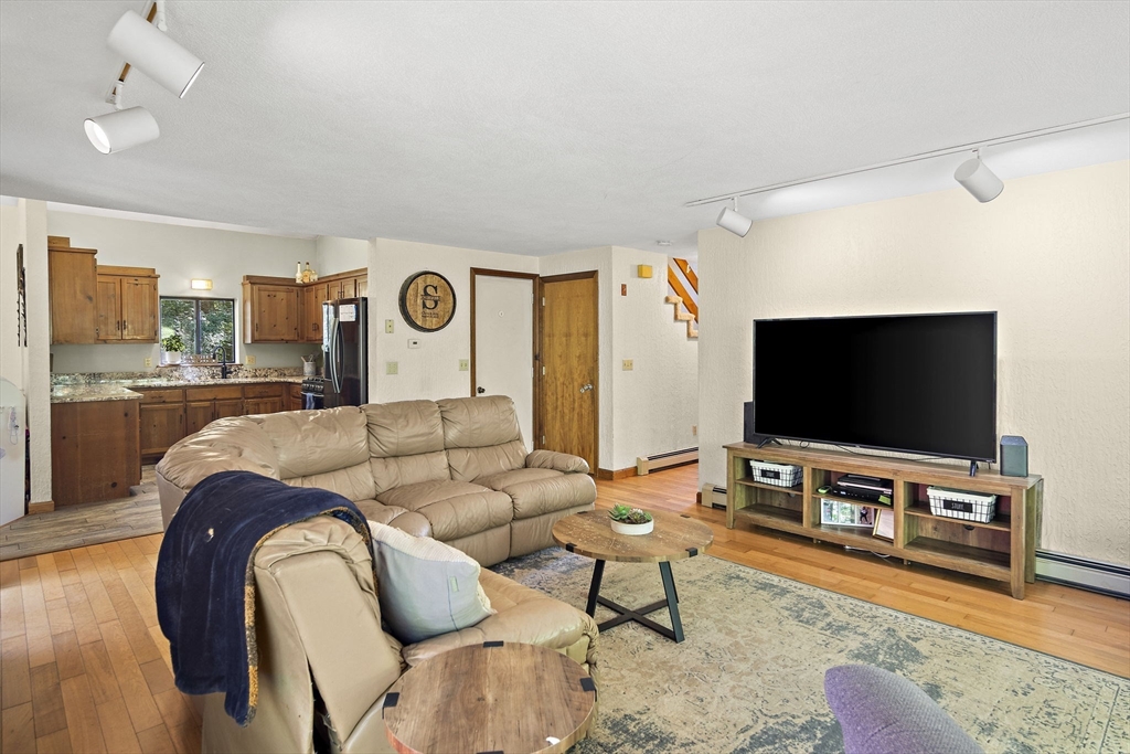 30 Harper Ridge Road Hampstead, NH 03826 - Photo 14 of 41 a living room with furniture and a flat screen tv