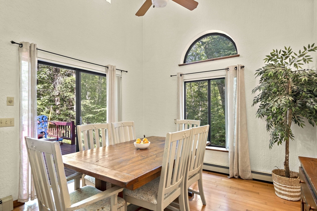 30 Harper Ridge Road Hampstead, NH 03826 - Photo 19 of 41 a view of a dining room with furniture window and wooden floor
