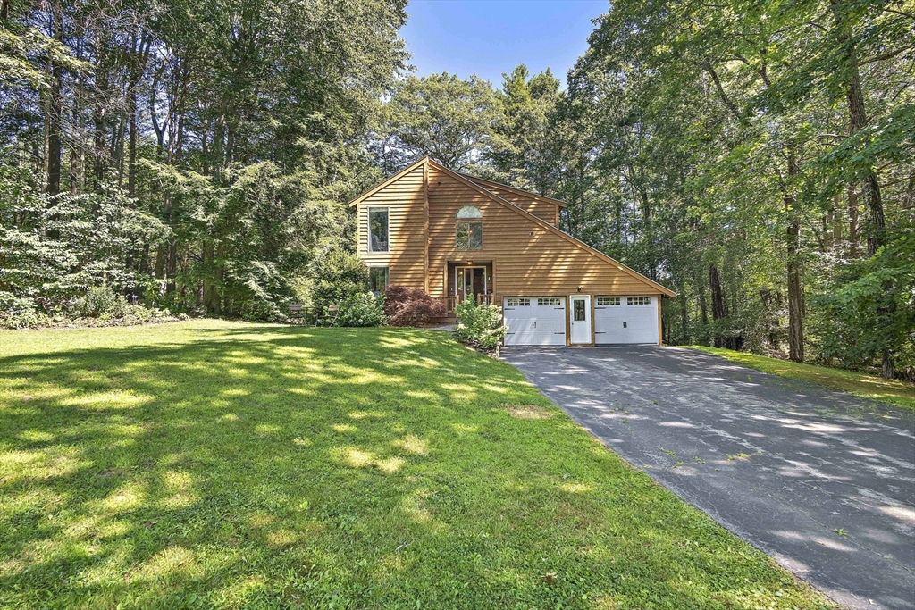 30 Harper Ridge Road Hampstead, NH 03826 - Photo 2 of 41 a house with huge green field in front of it