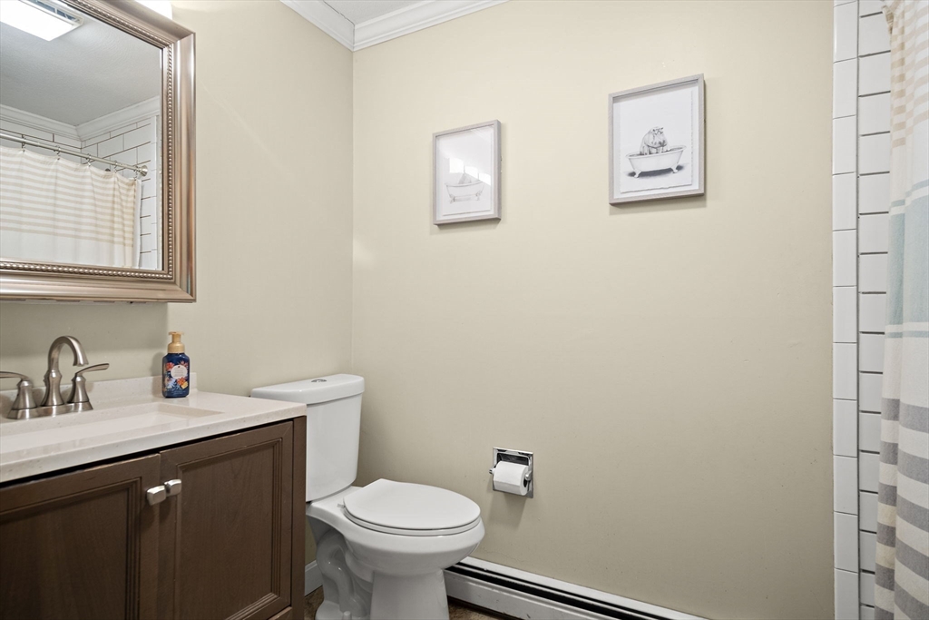 30 Harper Ridge Road Hampstead, NH 03826 - Photo 22 of 41 a bathroom with a sink mirror and a toilet