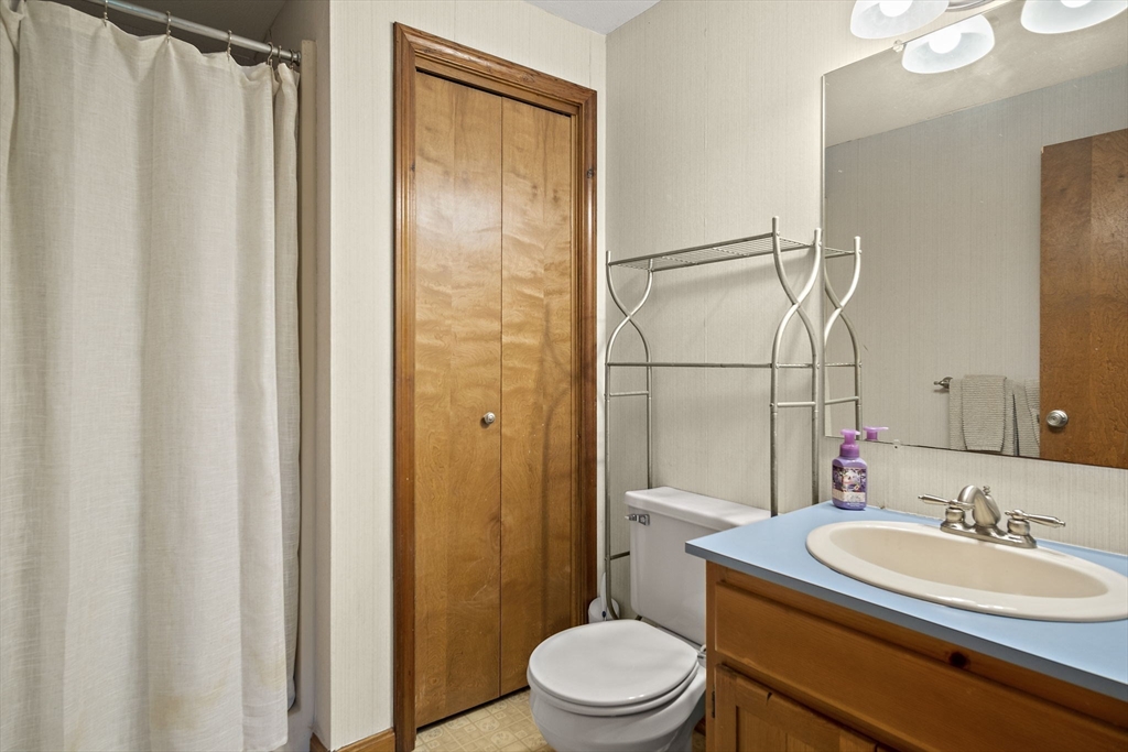30 Harper Ridge Road Hampstead, NH 03826 - Photo 25 of 41 a bathroom with a sink a toilet and shower