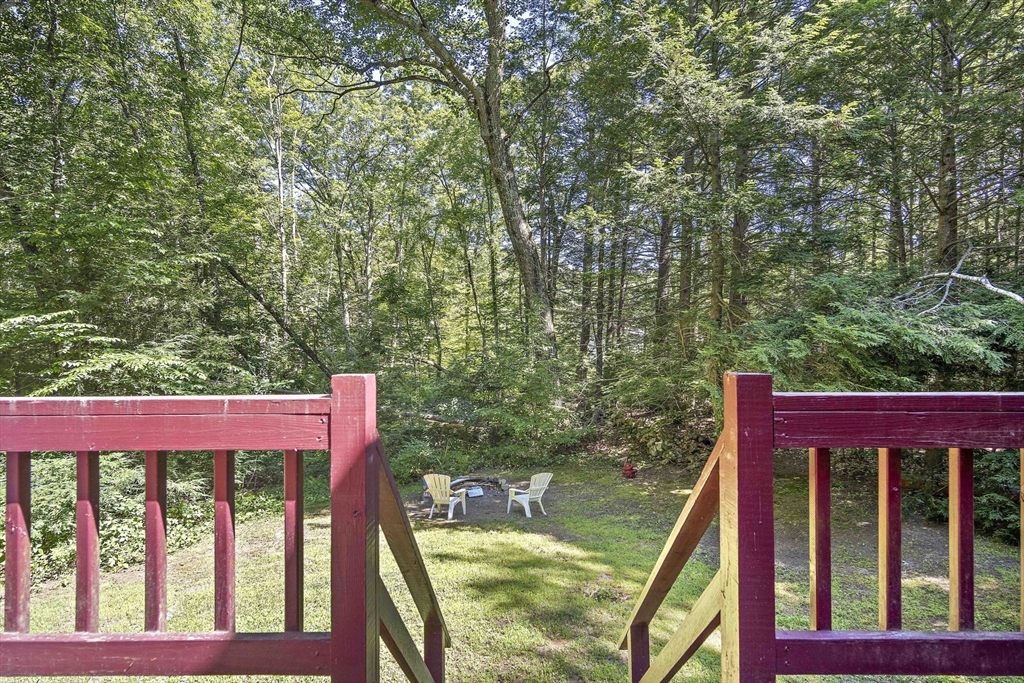 30 Harper Ridge Road Hampstead, NH 03826 - Photo 35 of 41 a view of a wooden deck next to a yard