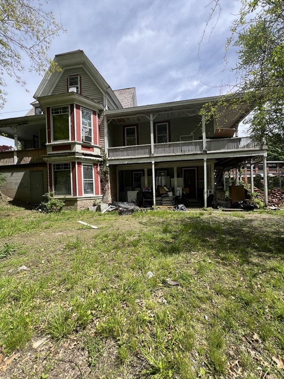 351 Bridge Street Northampton, MA 01060 - Photo 5 of 29 a front view of a house with a yard