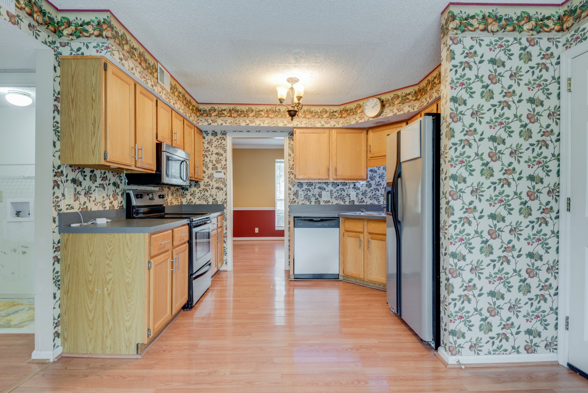 369 Cedarcliff Road Antioch, TN 37013 - Photo 8 of 24 a kitchen with stainless steel appliances a stove a sink and a refrigerator