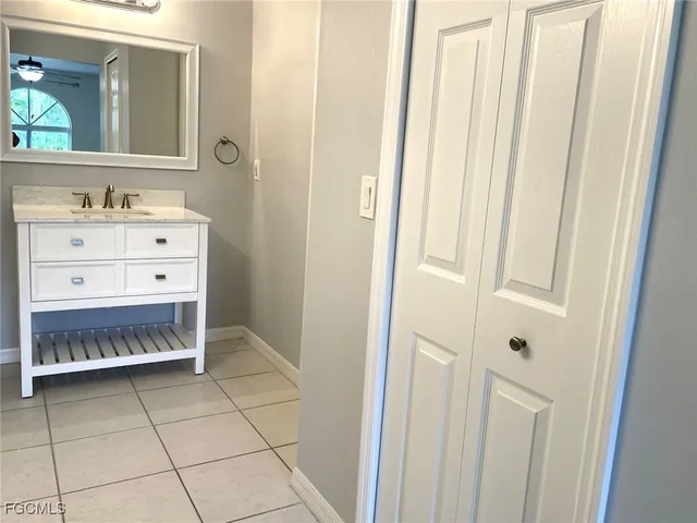 a bathroom with a mirror and a sink