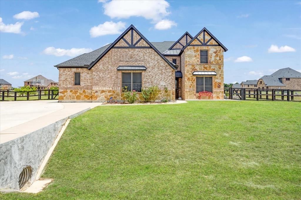 1205 Redbud Street Howe, TX 75459 - Photo 2 of 40 a front view of a house with a yard