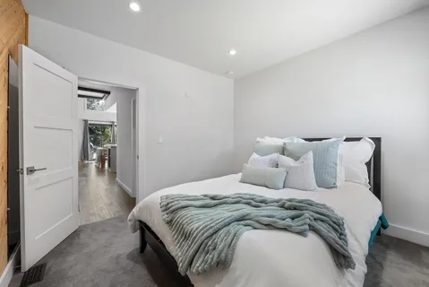 a bedroom with a bed and a walk in closet