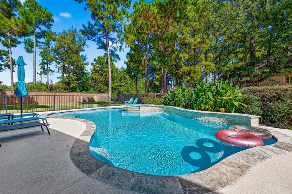 a view of a swimming pool with a patio