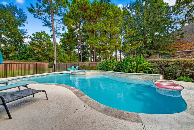 a view of a swimming pool with a patio