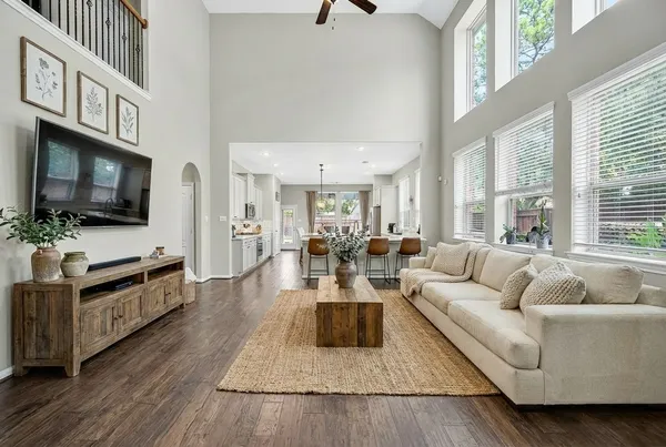 a living room with fireplace furniture and a flat screen tv