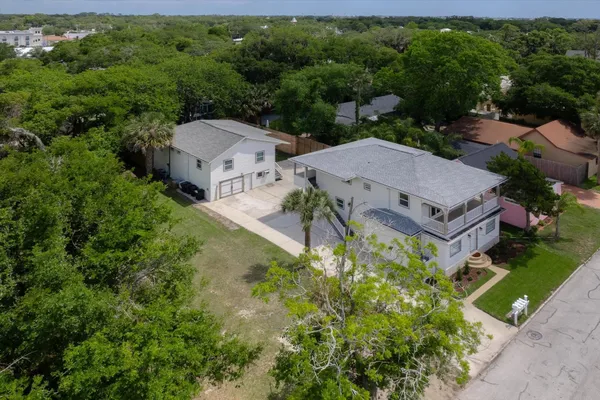 an aerial view of a house with a garden