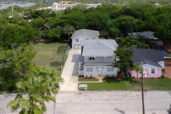 an aerial view of a house with a garden
