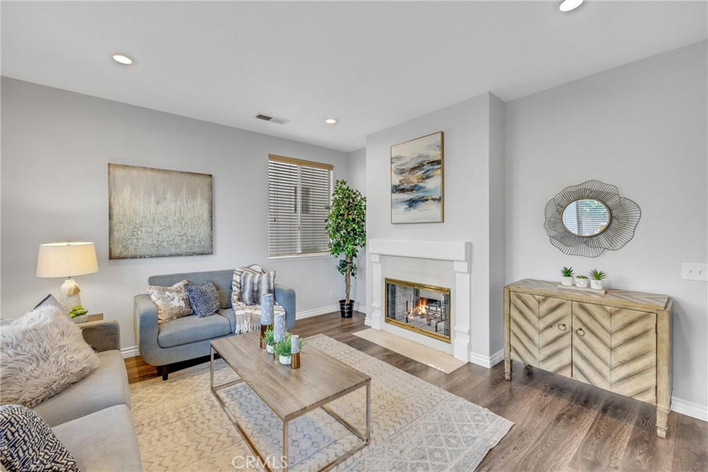 738 Orchard Loop Azusa, CA 91702 - Photo 15 of 50 a living room with furniture and a fireplace