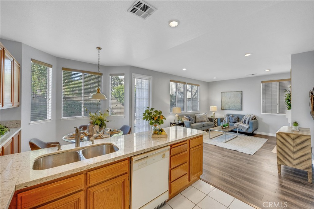 738 Orchard Loop Azusa, CA 91702 - Photo 26 of 50 a kitchen with sink refrigerator and large window