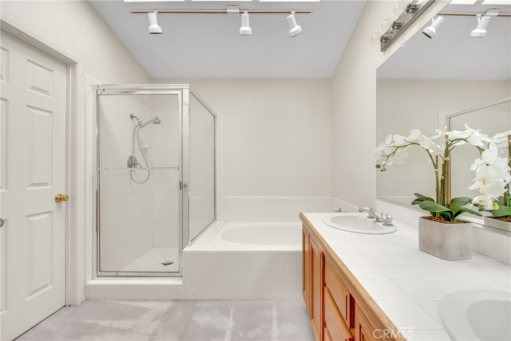 738 Orchard Loop Azusa, CA 91702 - Photo 35 of 50 a bath room with a sink tub and shower