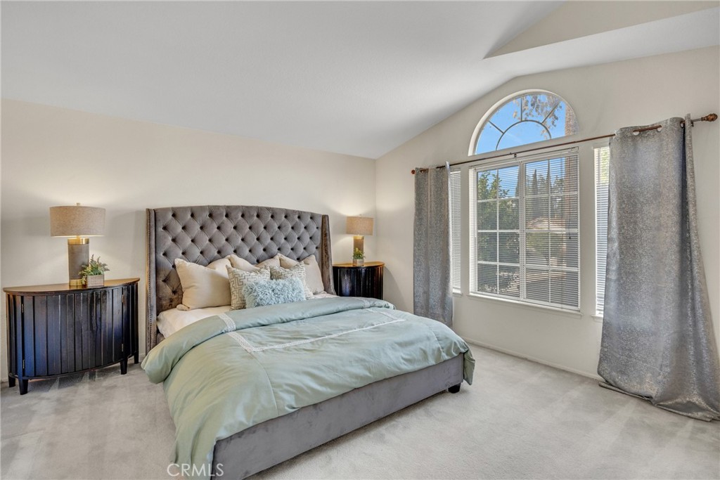 738 Orchard Loop Azusa, CA 91702 - Photo 39 of 50 a bedroom with a bed a dresser and a window