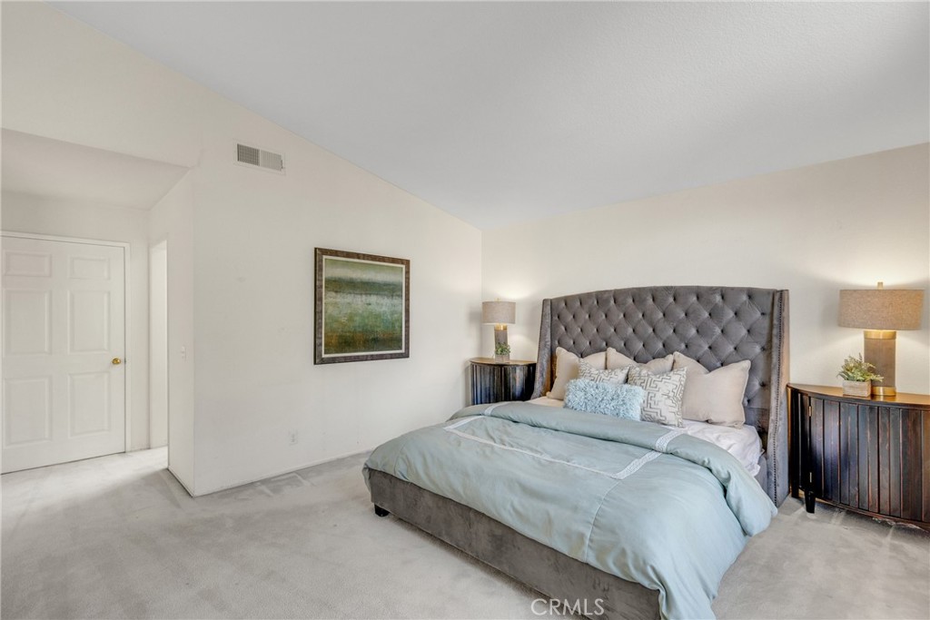 738 Orchard Loop Azusa, CA 91702 - Photo 40 of 50 a bedroom with a bed and a painting